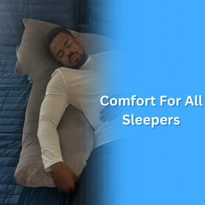 This image features a man lying on his side, comfortably resting on the grey Special T Pillow. The text 'Comfort For All Sleepers' underscores the pillow's versatility, suitable for various sleeping positions, showcased on a blue bed.